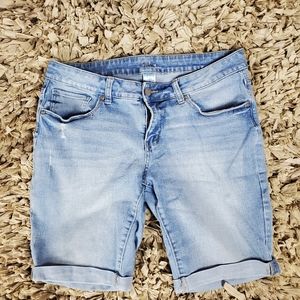 Distressed roll cuff Bermuda shorts.